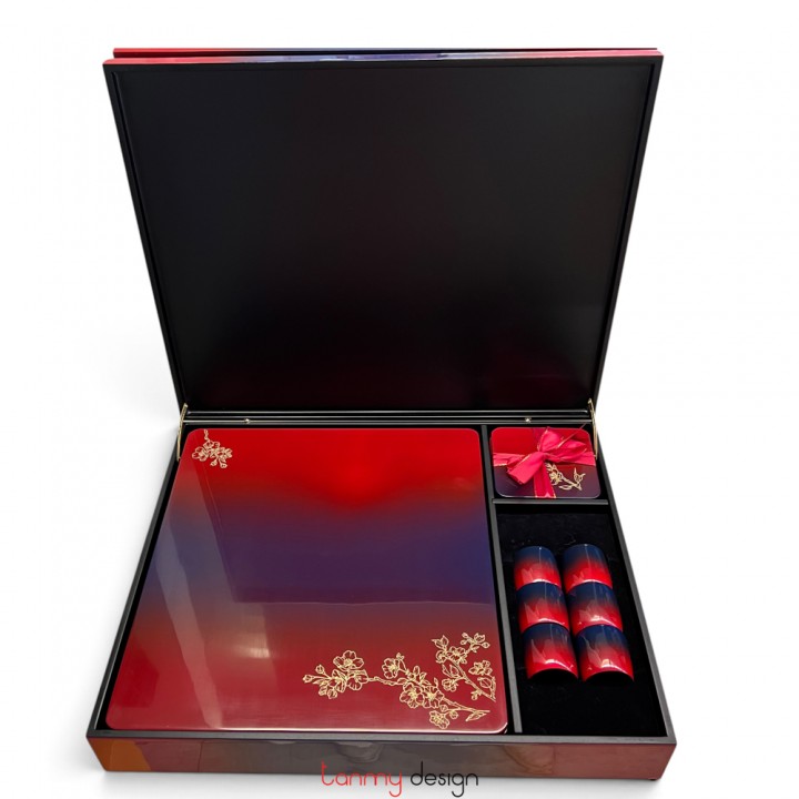 Red rectangular lacquer box included with 6 placemats, 6 coasters and 6 napkin rings with peach blossom pattern